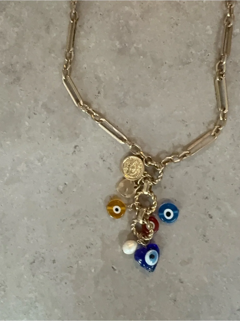 REVOLVE Gold Charm Necklace with Blue, Yellow, Red and White Evil Eye Accents